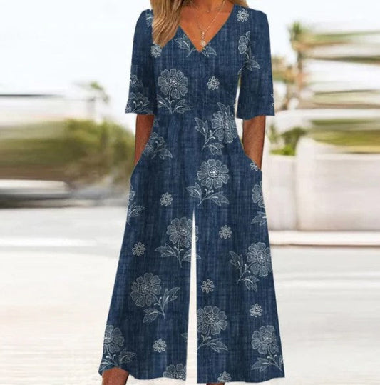 Mia – blauwe playsuit met bloemen